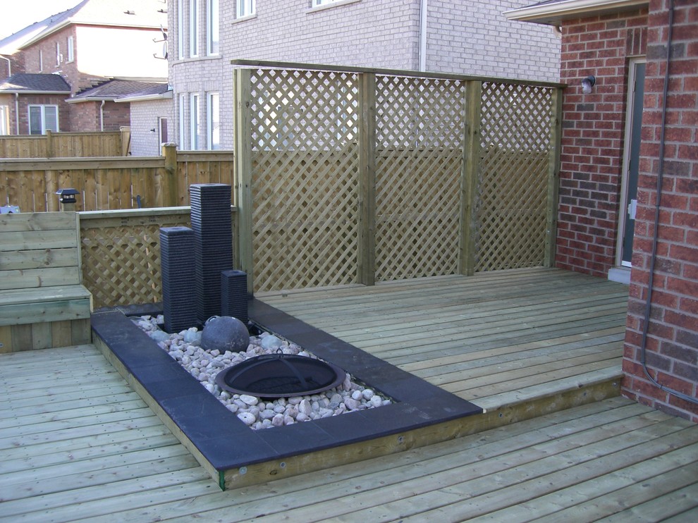 Deck - large transitional deck idea in Toronto