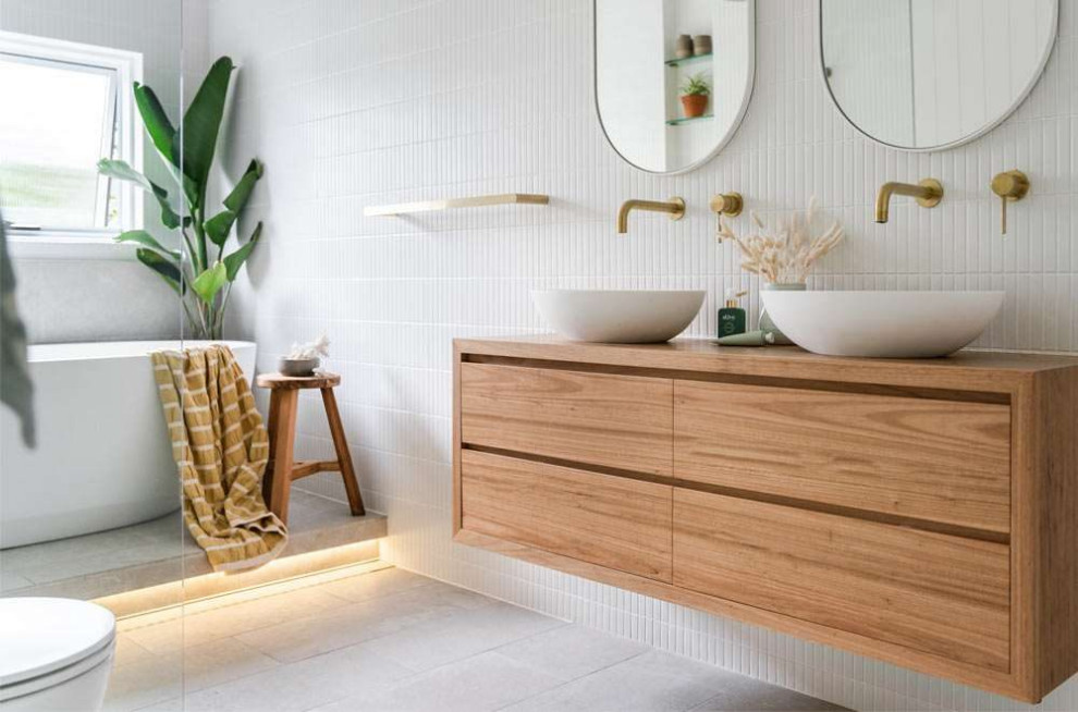 Inspiration for a large contemporary ensuite wet room bathroom in Perth with freestanding cabinets, dark wood cabinets, a freestanding bath, white tiles, matchstick tiles, white walls, porcelain flooring, a vessel sink, wooden worktops, grey floors, an open shower, brown worktops, double sinks, a floating vanity unit, exposed beams and tongue and groove walls.