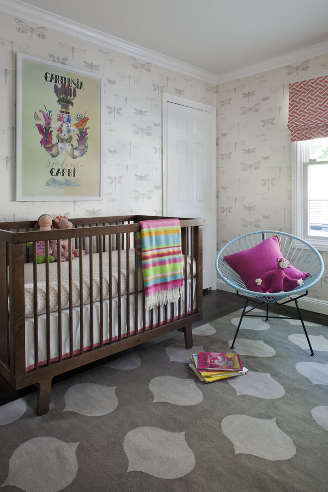 Inspiration for a transitional nursery for girls in San Francisco with beige walls and dark hardwood floors.