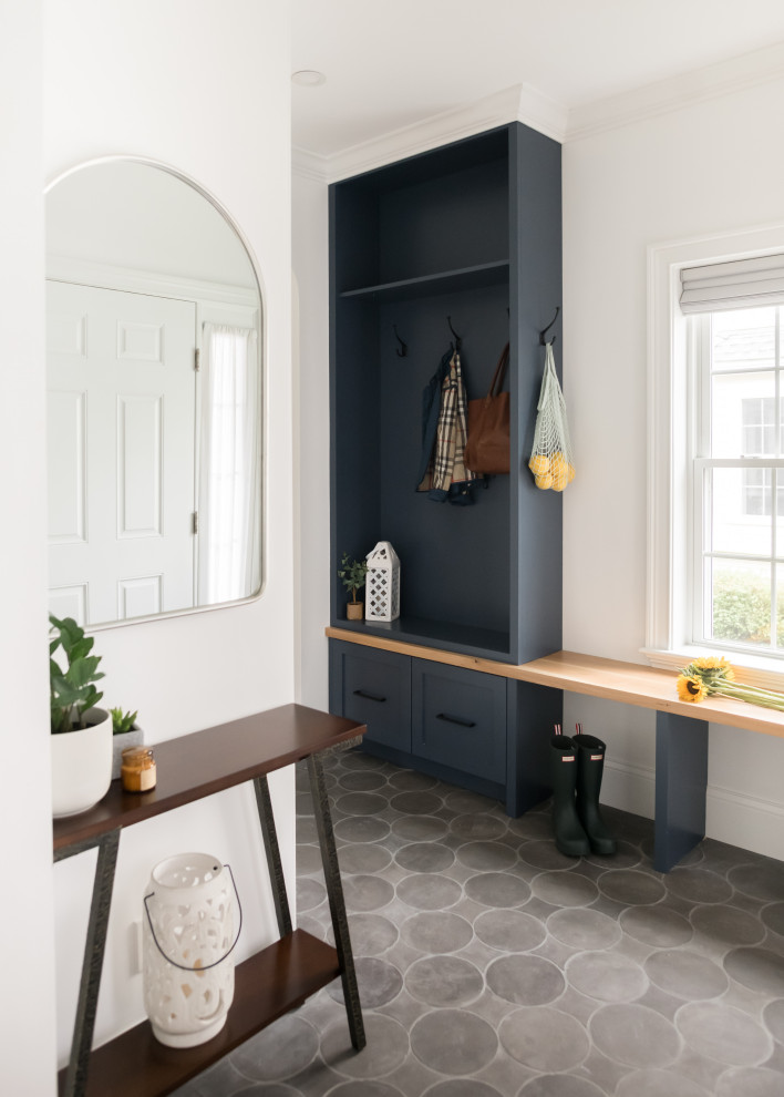 Mid-sized transitional mudroom in Boston with white walls, ceramic floors, a single front door, a white front door and grey floor.
