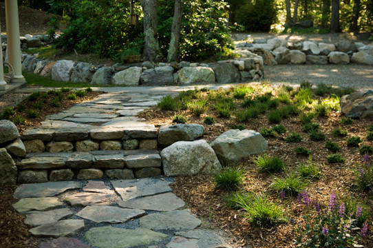 Photo of a country side yard shaded garden in Boston with natural stone pavers.