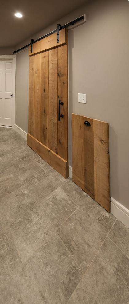 Example of a mid-sized transitional porcelain tile and beige floor home design design with gray walls
