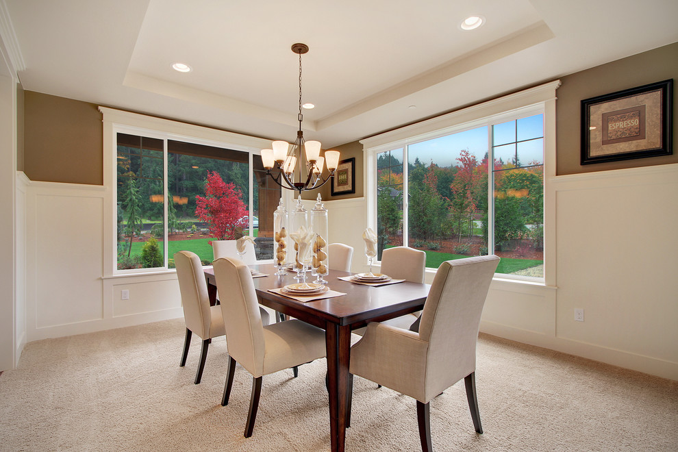 This is an example of an arts and crafts dining room in Seattle with brown walls and carpet.