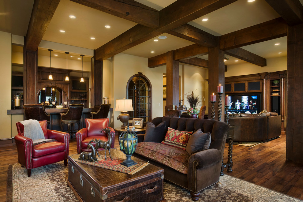 Photo of a country open concept family room in Other with beige walls and dark hardwood floors.