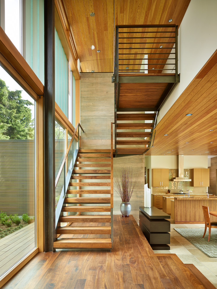 Contemporary wood staircase in Seattle with open risers.