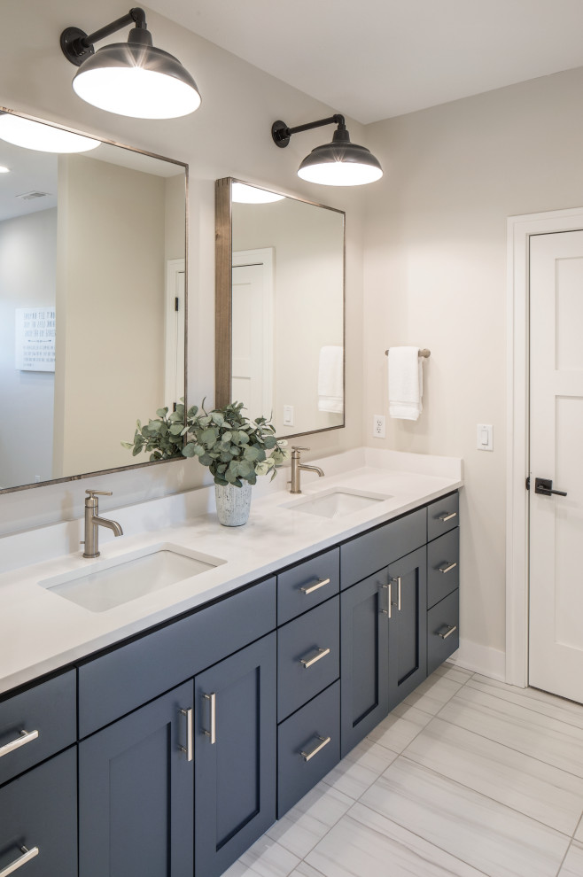Mid-sized minimalist kids' porcelain tile, white floor and double-sink bathroom photo in Omaha with shaker cabinets, blue cabinets, white walls, an undermount sink, quartz countertops, white countertops and a built-in vanity