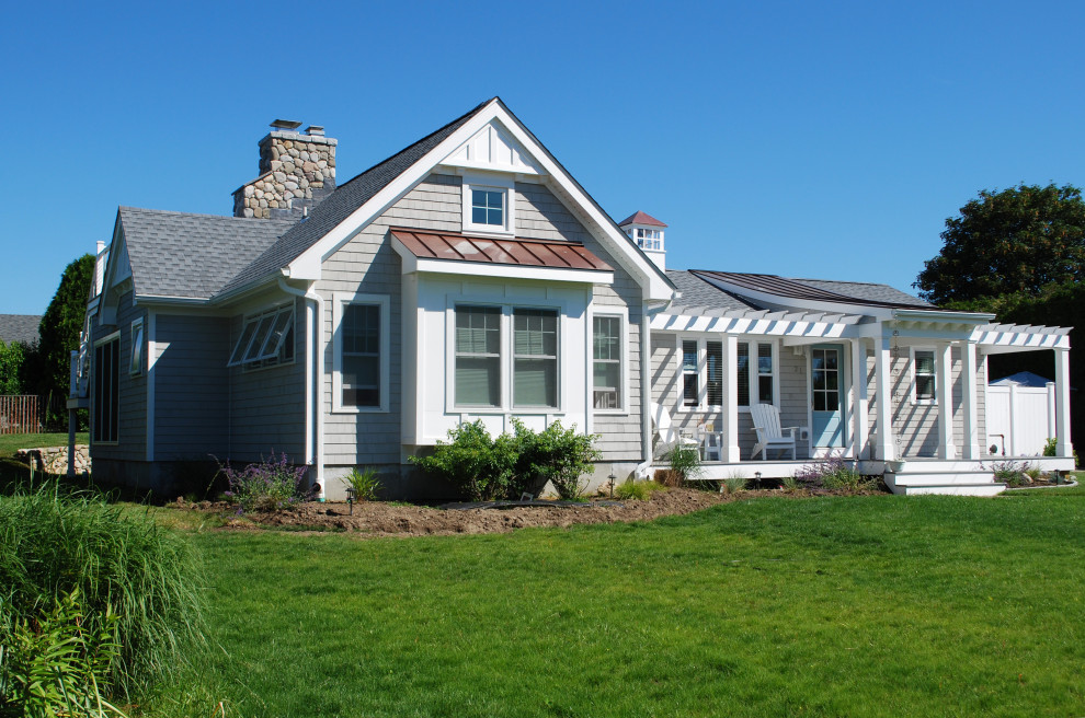 Inspiration for a mid-sized beach style one-storey grey house exterior in Providence with wood siding, a gable roof, a mixed roof and shingle siding.