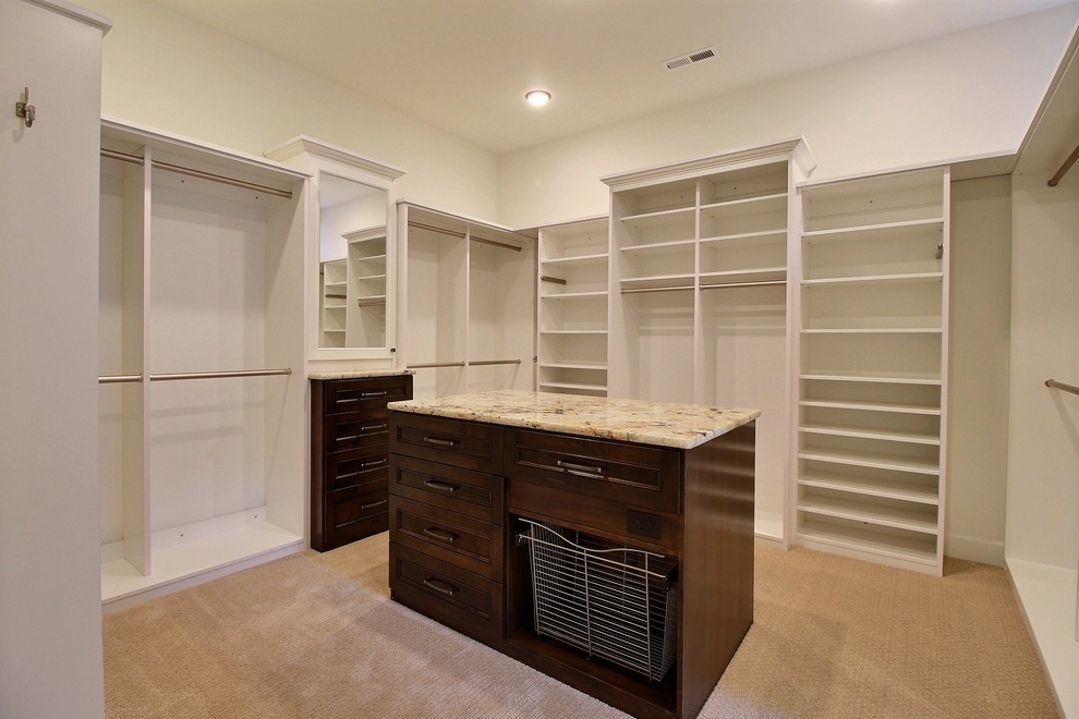 Design ideas for an expansive traditional gender-neutral walk-in wardrobe in Portland with open cabinets, white cabinets, carpet and beige floor.