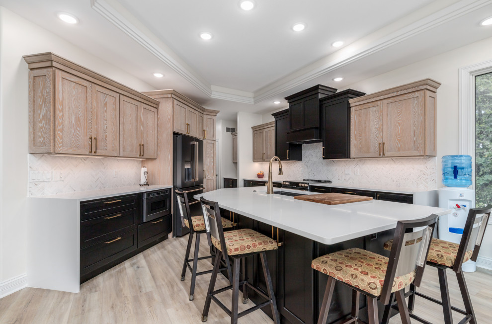 Two-Tone Kitchen with Quartz Island and Herringbone Backsplash