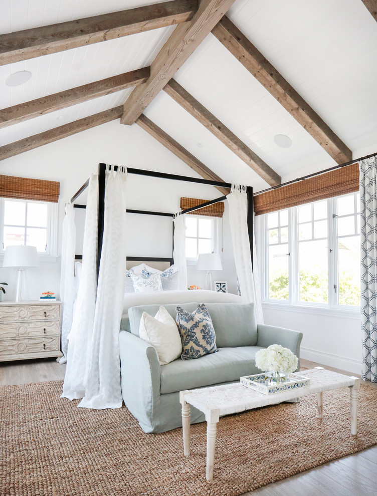 Bedroom - mid-sized coastal master light wood floor bedroom idea in Orange County with white walls