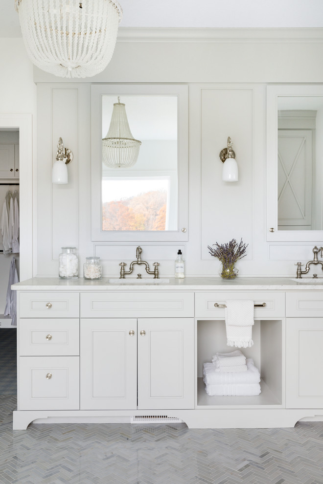 Inspiration for a large beach style master bathroom in Minneapolis with grey cabinets, a freestanding tub, an alcove shower, a one-piece toilet, gray tile, marble, white walls, marble floors, an undermount sink, marble benchtops, grey floor and an open shower.