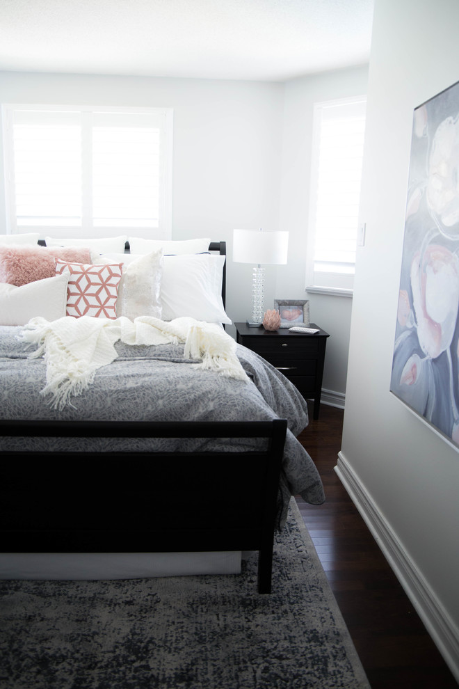 Photo of a large traditional master bedroom in Toronto with grey walls, dark hardwood floors and brown floor.