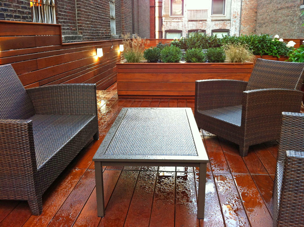 Mid-sized contemporary rooftop deck in New York with a container garden and no cover.