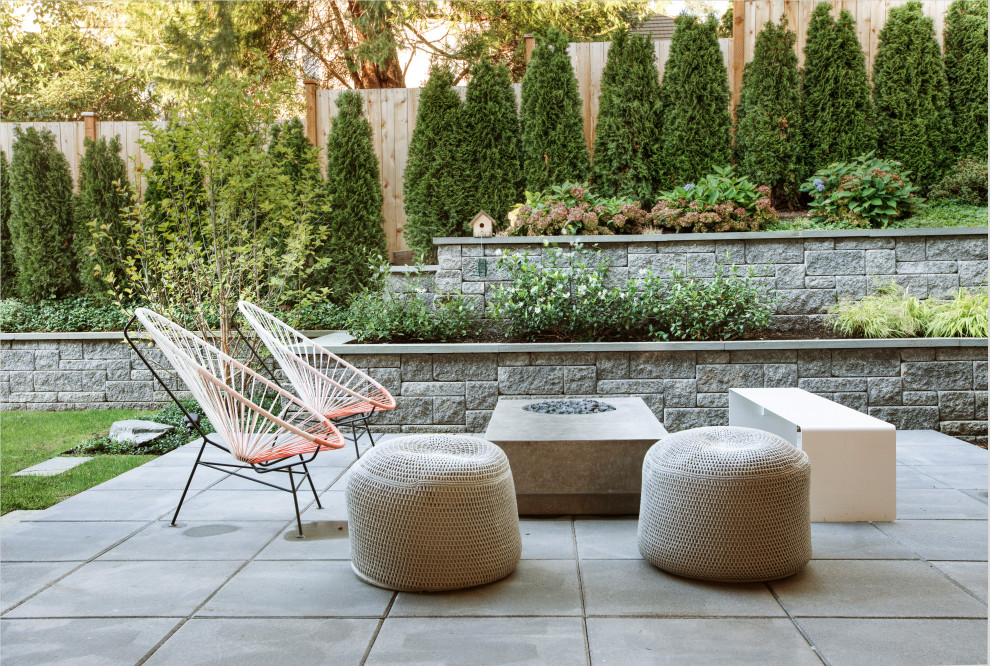 Design ideas for a mid-sized contemporary backyard patio in Seattle with no cover and concrete pavers.
