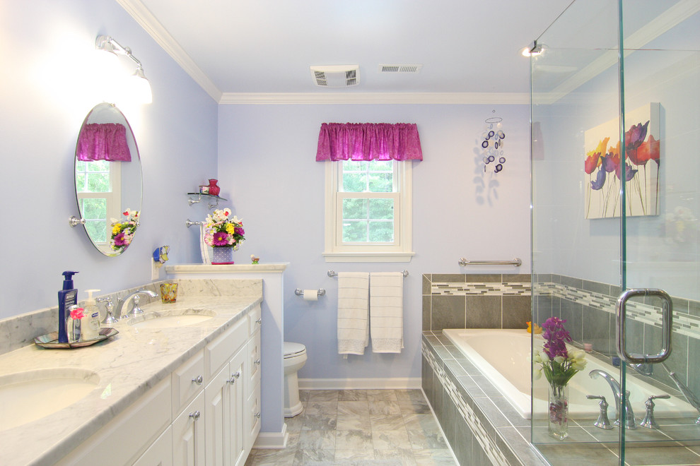 Mid-sized transitional master bathroom in Other with an undermount sink, raised-panel cabinets, white cabinets, marble benchtops, a drop-in tub, an open shower, a two-piece toilet, gray tile, porcelain tile, purple walls and linoleum floors.