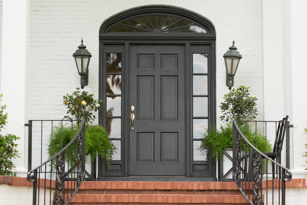This is an example of a traditional front door in Little Rock with a single front door and a black front door.