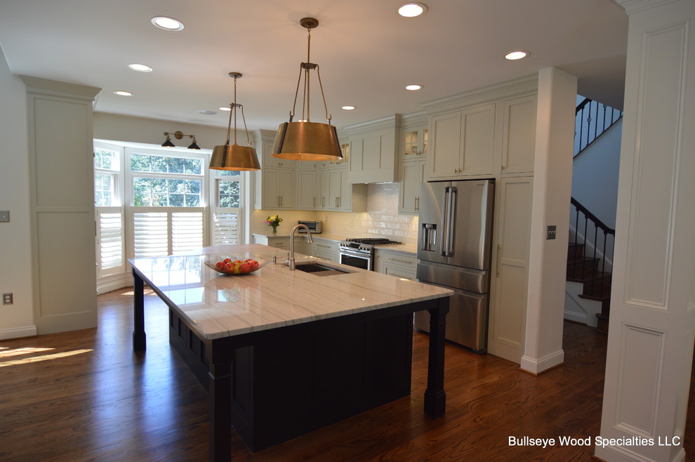 Eat-in kitchen - large transitional u-shaped medium tone wood floor and brown floor eat-in kitchen idea in DC Metro with a single-bowl sink, shaker cabinets, gray cabinets, quartzite countertops, white backsplash, ceramic backsplash, stainless steel appliances, an island and white countertops