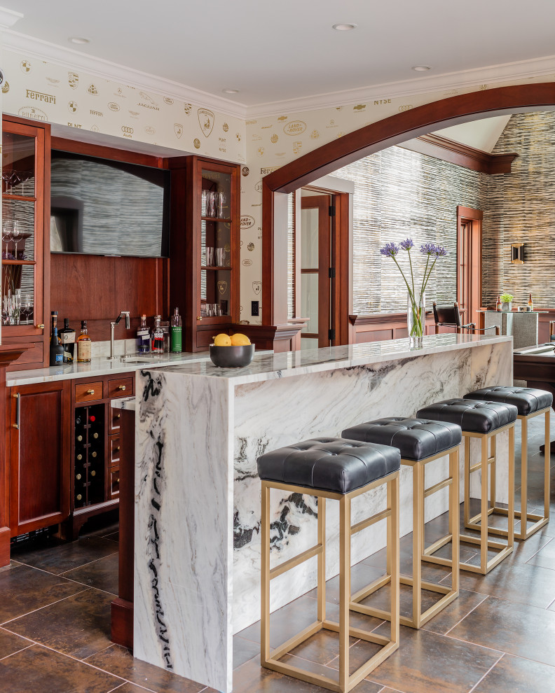 This is an example of a large contemporary galley wet bar in Boston with an undermount sink, recessed-panel cabinets, marble benchtops, timber splashback, ceramic floors, brown floor, light wood cabinets, brown splashback and white benchtop.