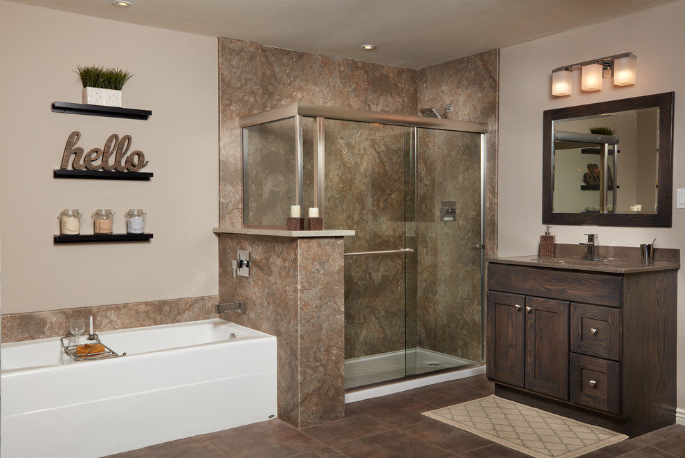 Inspiration for a mid-sized transitional master stone slab porcelain tile and beige floor alcove bathtub remodel with recessed-panel cabinets, dark wood cabinets, beige walls, an integrated sink and solid surface countertops