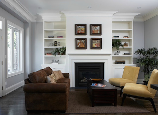 Inspiration for a mid-sized traditional formal open concept living room in Toronto with white walls, dark hardwood floors, a standard fireplace, a wood fireplace surround and a built-in media wall.