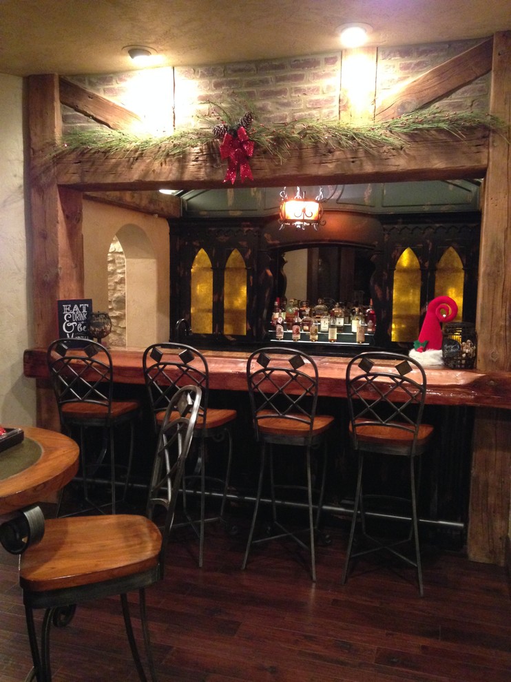 Seated home bar - mid-sized rustic single-wall dark wood floor seated home bar idea with dark wood cabinets