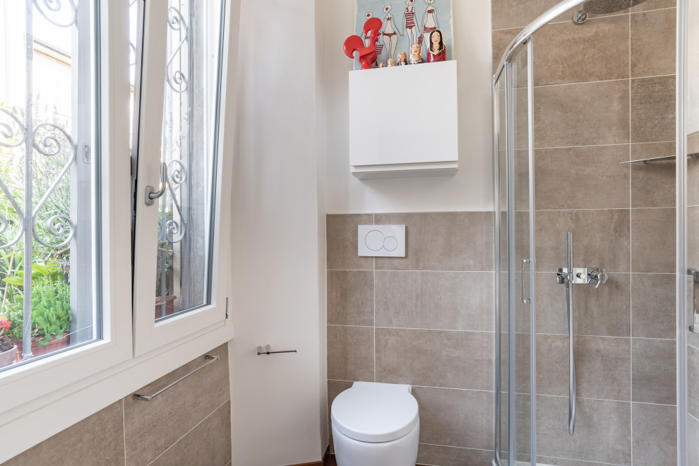 Photo of a small contemporary cloakroom in Other with a one-piece toilet, brown tiles, terracotta tiles, white walls and a freestanding vanity unit.