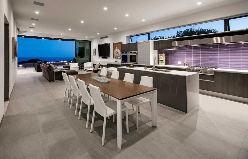 Photo of a mid-sized contemporary u-shaped open plan kitchen in Los Angeles with an undermount sink, flat-panel cabinets, dark wood cabinets, quartz benchtops, pink splashback, mosaic tile splashback, stainless steel appliances, porcelain floors, with island and grey floor.