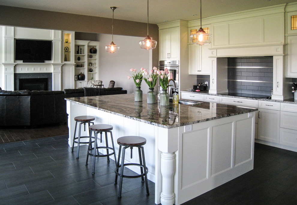 Example of a transitional l-shaped gray floor eat-in kitchen design in Toronto with an undermount sink, white cabinets, granite countertops, gray backsplash, stainless steel appliances and an island