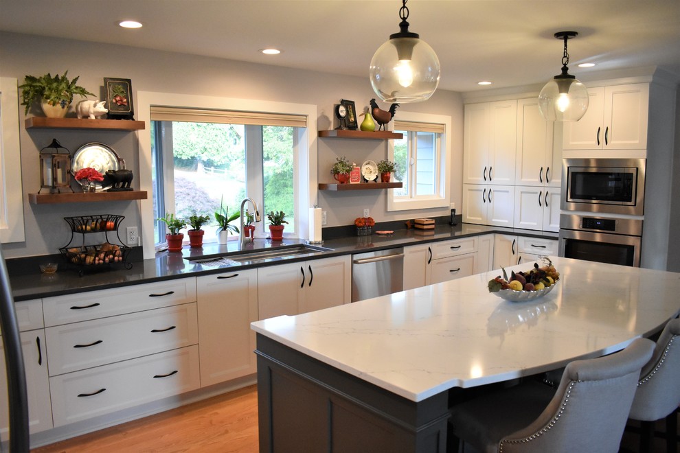 Example of a transitional kitchen design in Seattle