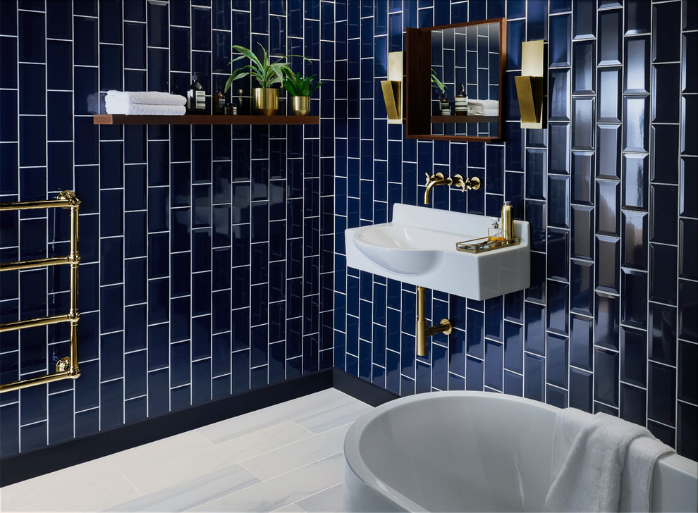 Design ideas for a contemporary bathroom in Other with a freestanding tub, blue tile, ceramic tile, blue walls and grey floor.