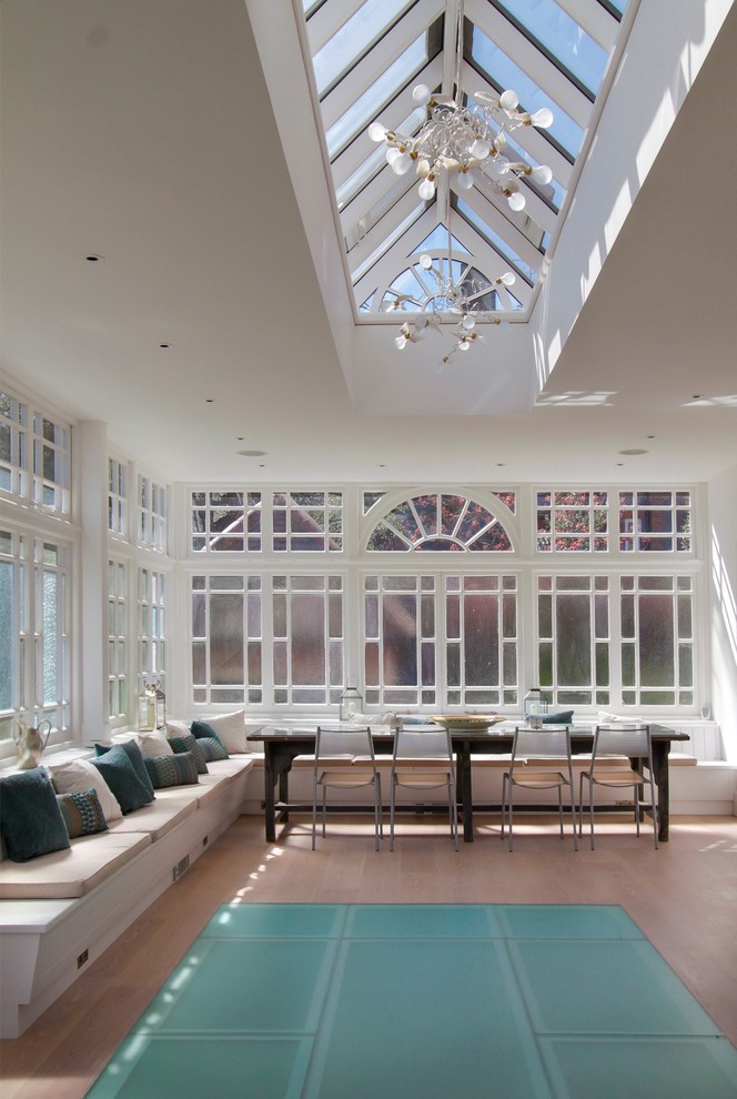 Design ideas for a large transitional sunroom in London with no fireplace.