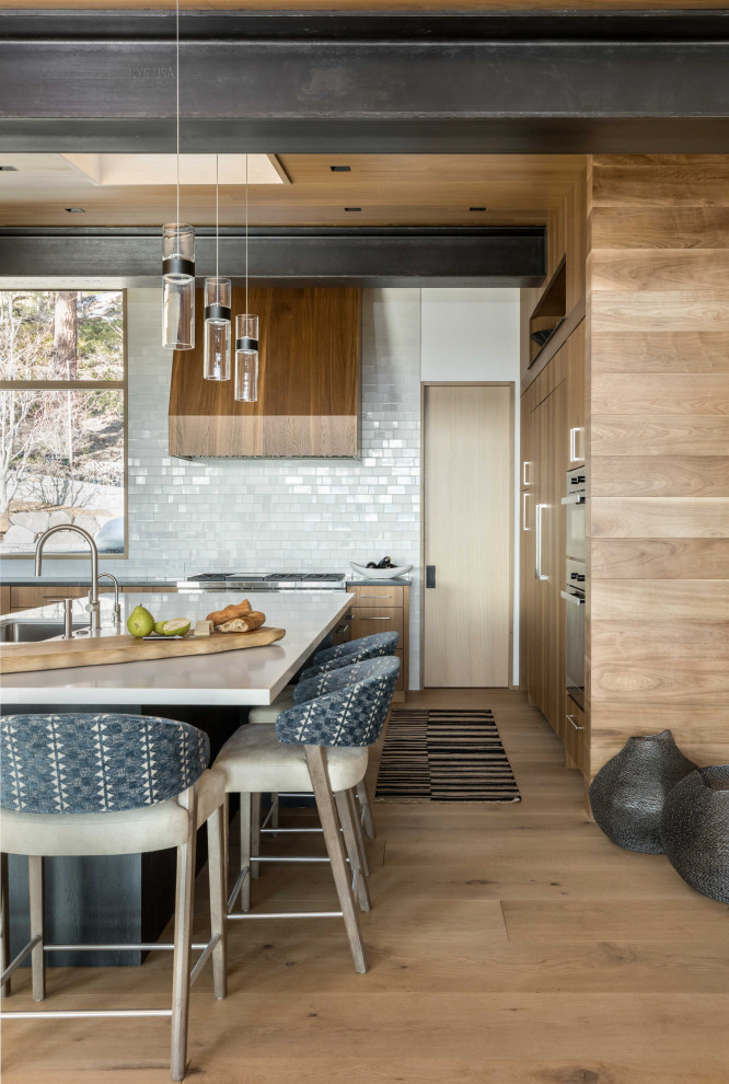 This is an example of a large rustic u-shaped open plan kitchen in Other with flat-panel cabinets, engineered stone countertops, white splashback, ceramic splashback, integrated appliances, an island and a wood ceiling.