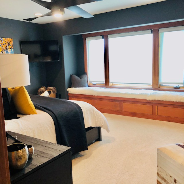 Example of a transitional home design design in Denver