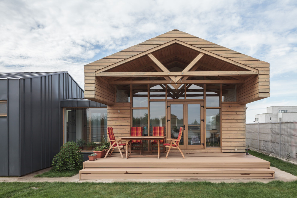 Inspiration for a contemporary deck in Other with a roof extension.