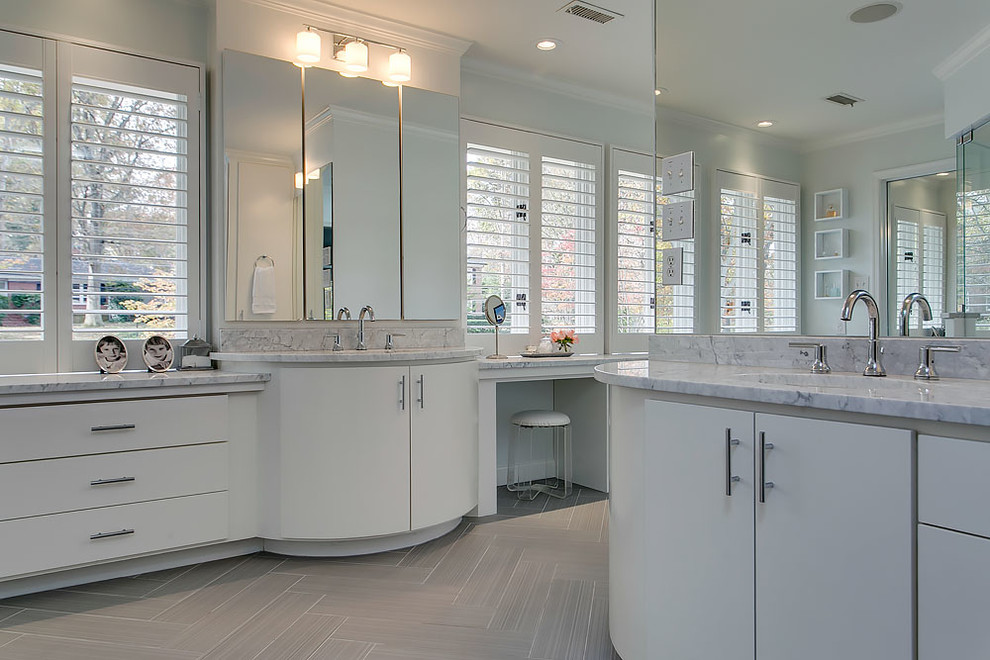 Inspiration for a transitional gray tile ceramic tile freestanding bathtub remodel in Raleigh with flat-panel cabinets, white cabinets, an undermount sink and marble countertops