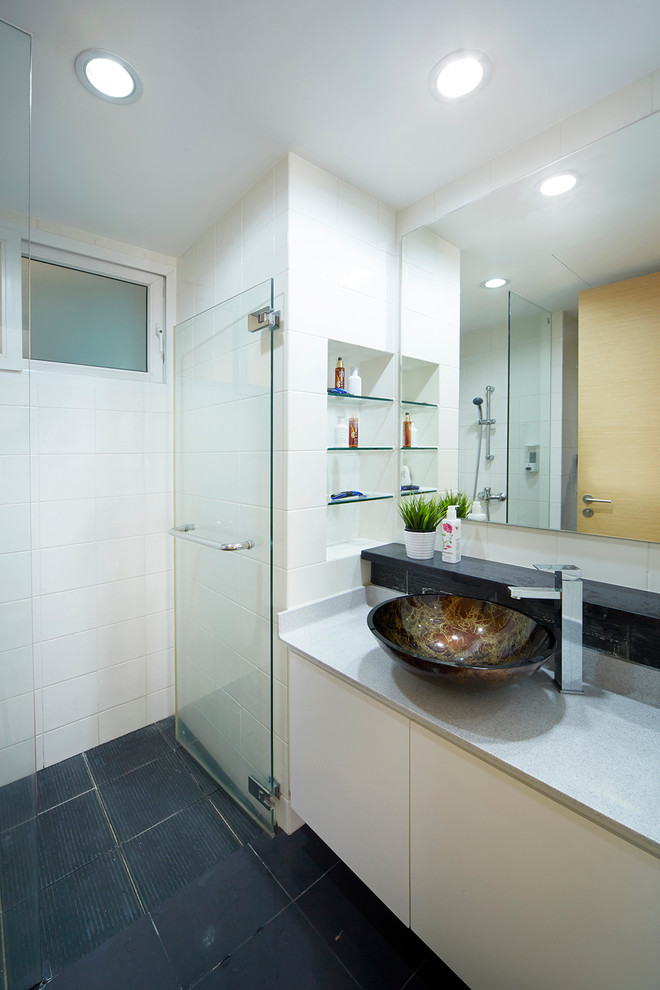 Small modern bathroom in Singapore with solid surface benchtops, gray tile, ceramic tile, white walls and ceramic floors.