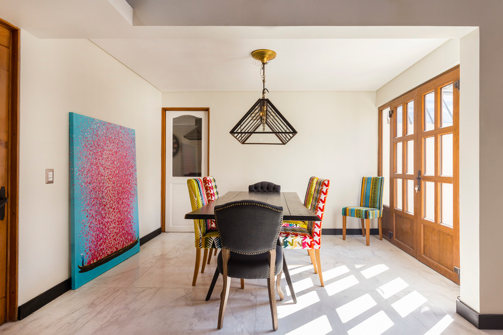 This is an example of an eclectic dining room in Other with white walls.