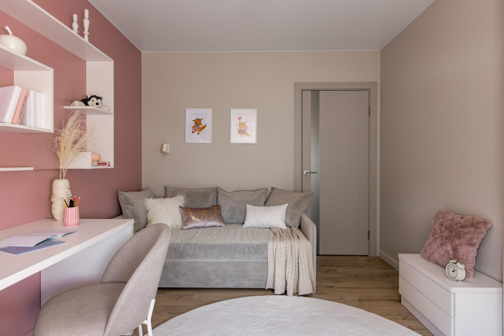 Inspiration for a contemporary children’s room for girls in Saint Petersburg with grey walls, laminate floors and beige floors.