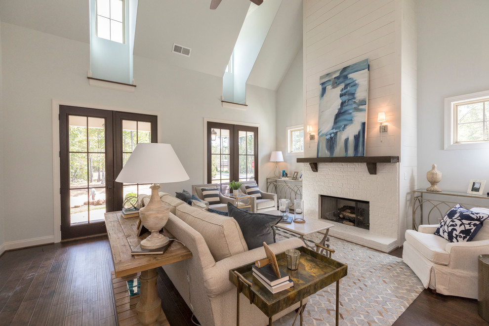 Design ideas for a mid-sized transitional formal open concept living room in Birmingham with white walls, dark hardwood floors, a standard fireplace, a brick fireplace surround and no tv.