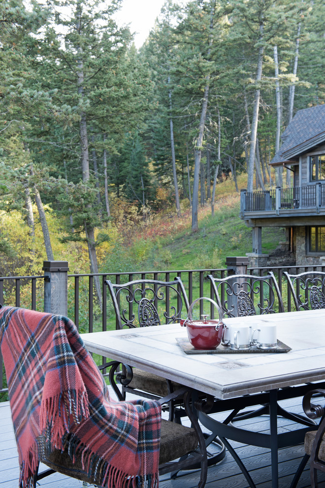 Huge mountain style backyard deck photo