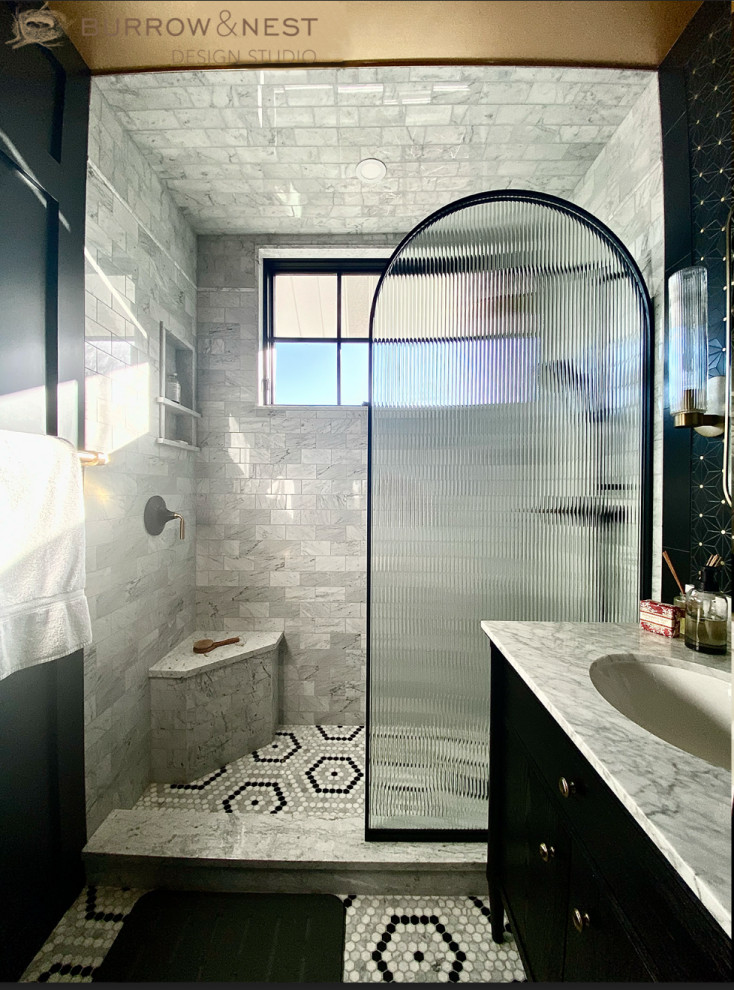 This is an example of a mid-sized traditional bathroom in Providence with flat-panel cabinets, black cabinets, an open shower, a two-piece toilet, black tile, marble, black walls, marble floors, an undermount sink, marble benchtops, multi-coloured floor, an open shower, white benchtops, a shower seat, a single vanity, a freestanding vanity and panelled walls.