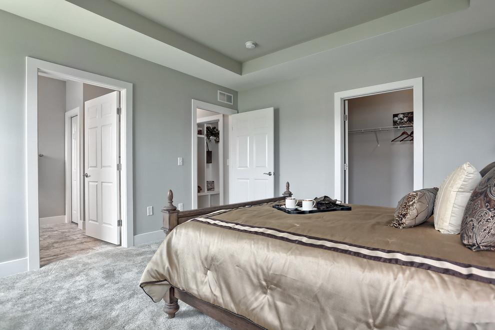 Photo of a large arts and crafts master bedroom in Other with beige walls, ceramic floors, no fireplace and beige floor.
