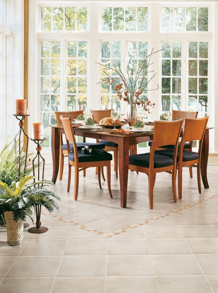Example of a transitional porcelain tile dining room design in Miami