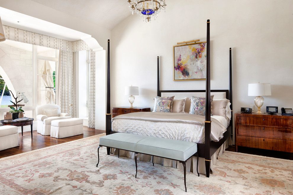 Design ideas for a mediterranean bedroom in Austin with white walls and dark hardwood floors.