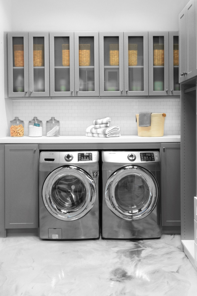 Inspiration for a contemporary laundry room in Burlington with grey cabinets and grey walls.
