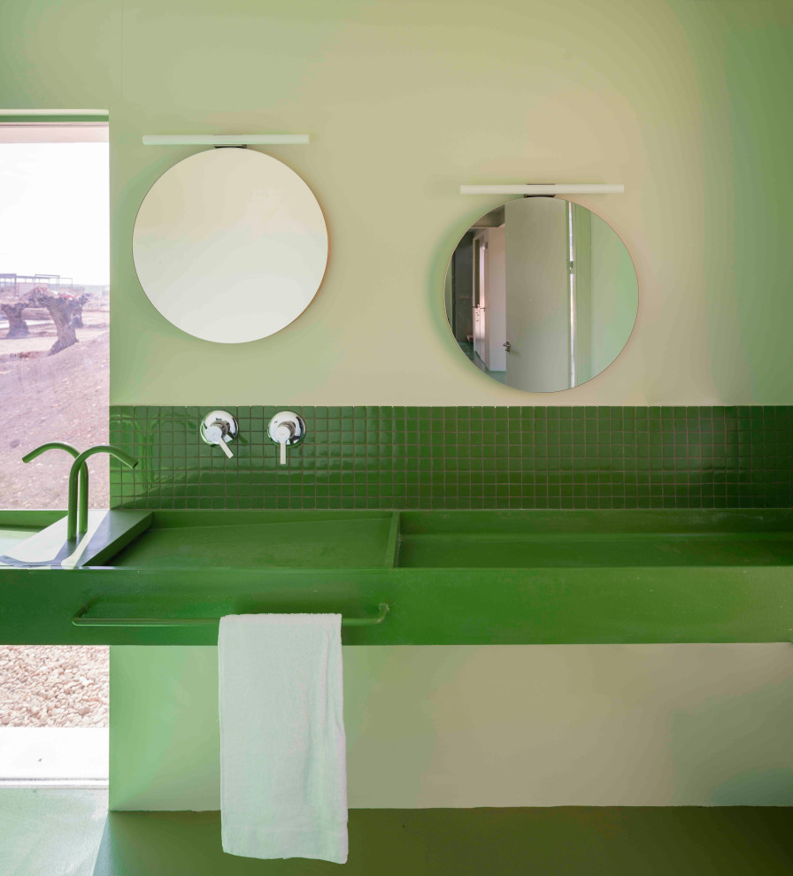 Large contemporary master bathroom in Other with a curbless shower, a wall-mount toilet, green tile, mosaic tile, green walls, concrete floors, a wall-mount sink, green floor, green benchtops, an enclosed toilet, a double vanity, a built-in vanity and exposed beam.