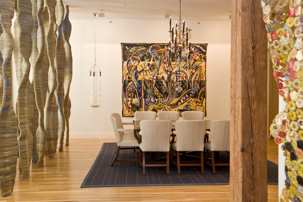 Photo of a mid-sized contemporary open plan dining in New York with beige walls, light hardwood floors and no fireplace.