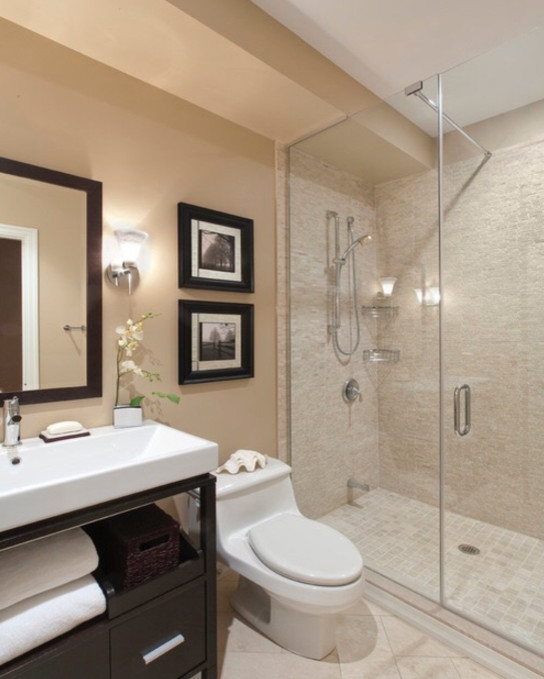 Inspiration for a mid-sized contemporary 3/4 bathroom in Newark with open cabinets, dark wood cabinets, an alcove shower, a one-piece toilet, beige tile, porcelain tile, beige walls, porcelain floors, a vessel sink and solid surface benchtops.
