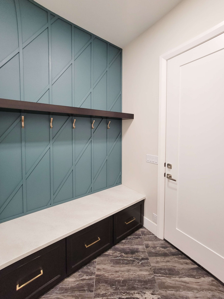 Inspiration for a mid-sized transitional porcelain tile and multicolored floor mudroom remodel with white walls and a white front door
