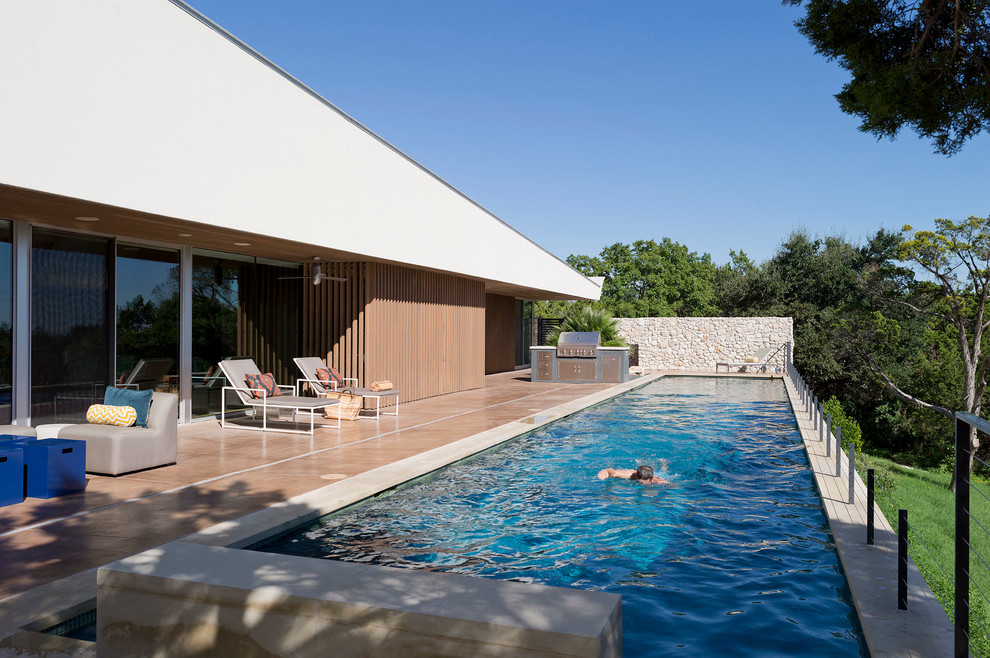 Photo of a modern rectangular lap pool in Austin.